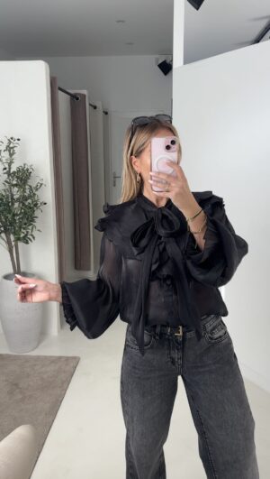 Blouse noire avec transparence, détails volants
